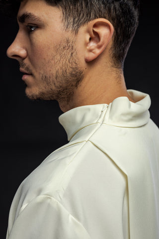 Embroidered priestly alb with a turtleneck and floral pattern in ecru color