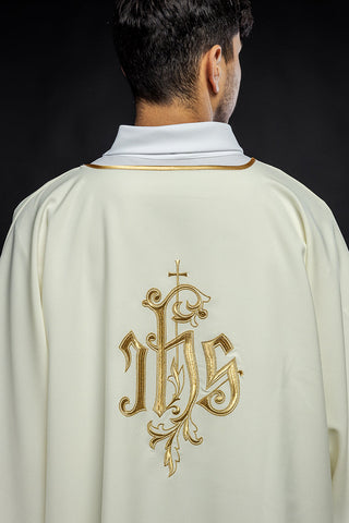 Ecru dalmatic with IHS embroidery and gold-satin trimming