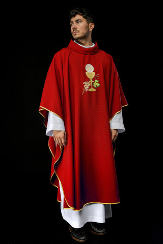 Red liturgical chasuble with embroidery of a chalice, the IHS symbol, and grapes