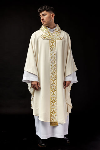 Ecru liturgical chasuble with shiny gold embroidery and satin trimming