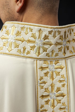 Ecru liturgical chasuble with shiny gold embroidery and satin trimming