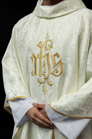 Ecru chasuble with IHS embroidery on decorative fabric