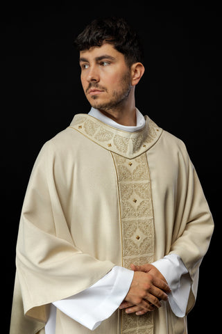 Ecru liturgical chasuble with richly embroidered band and collar