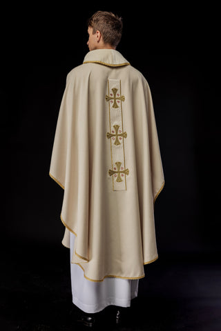 Liturgical chasuble with embroidered gold crosses and trim on the collar in ecru color