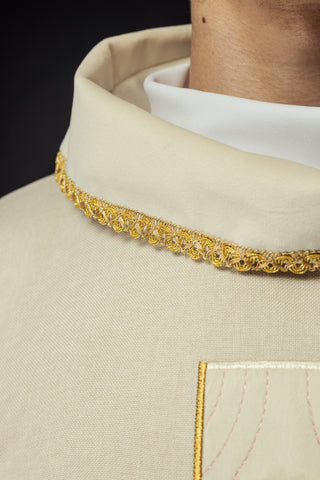 Liturgical chasuble with embroidered gold crosses and trim on the collar in ecru color