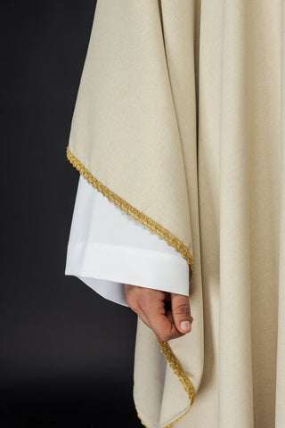 Liturgical chasuble with embroidered gold crosses and trim on the collar in ecru color