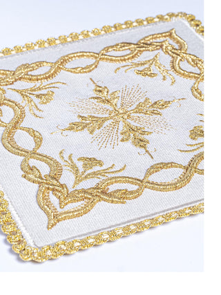 A complete set of ecru chalice linens with embroidery and gold cross embellishments