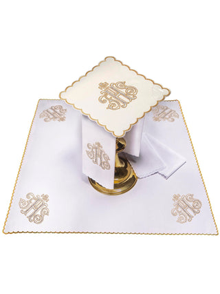 A complete set of chalice linens embroidered with IHS and an ecru pall