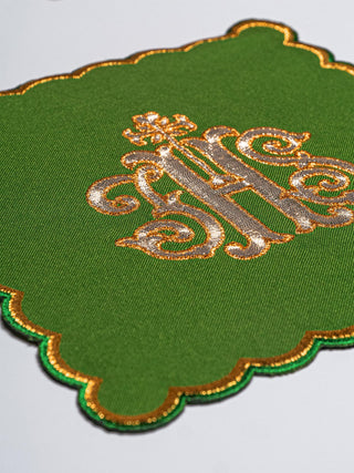 A complete set of chalice linens with a green pall and gold IHS embroidery