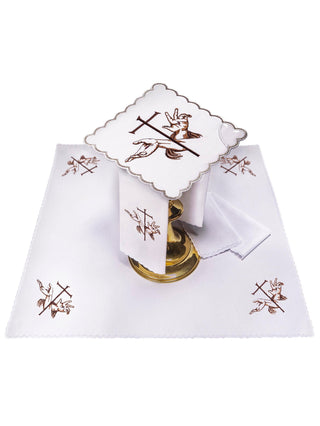 A complete set of chalice linens with a Franciscan symbol and Eucharistic embroidery