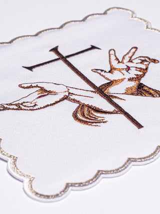 A complete set of chalice linens with a Franciscan symbol and Eucharistic embroidery