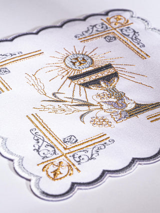 A set of richly decorated chalice linens with Eucharistic embroidery