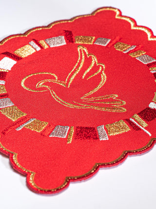 A set of red chalice linens with the embroidery of the Holy Spirit