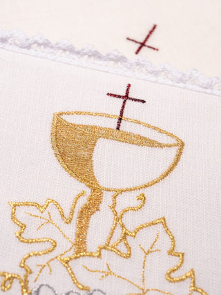 A complete set of linen chalice linens with eucharistic embroidery and gold crosses