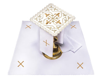 Chalice set with a cross motif, gold embellishments, and embroidered floral design