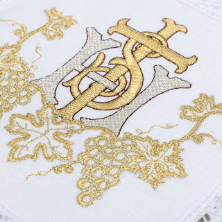 A set of linen chalice linens with delicate gold IHS embroidery