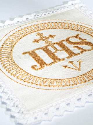 A set of linen chalice linens with IHS embroidery