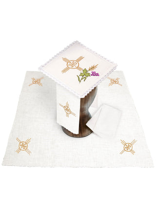 A set of linen chalice linens with IHS embroidery and a cross motif