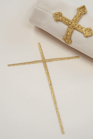 Ecru liturgical chasuble with an embroidered cross and gold trim