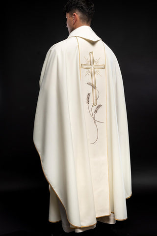 Ecru liturgical chasuble with an embroidered cross and the IHS symbol