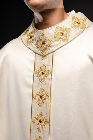 Ecru liturgical chasuble with an embroidered band and collar adorned with stones