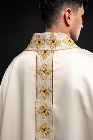 Ecru liturgical chasuble with an embroidered band and collar adorned with stones