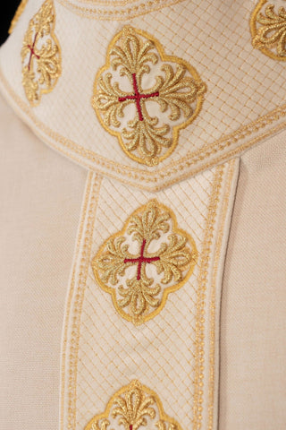 Ecru liturgical chasuble with an embroidered band and collar featuring crosses