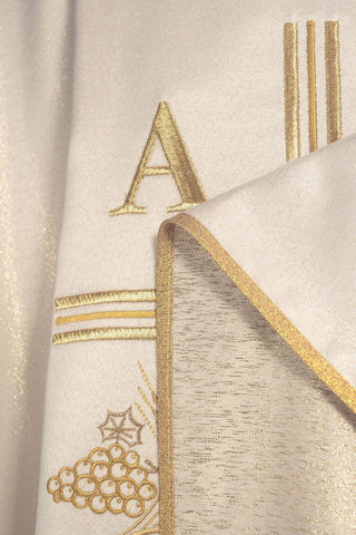 Ecru liturgical chasuble with an embroidered cross, Alpha and Omega motifs, and ears of wheat